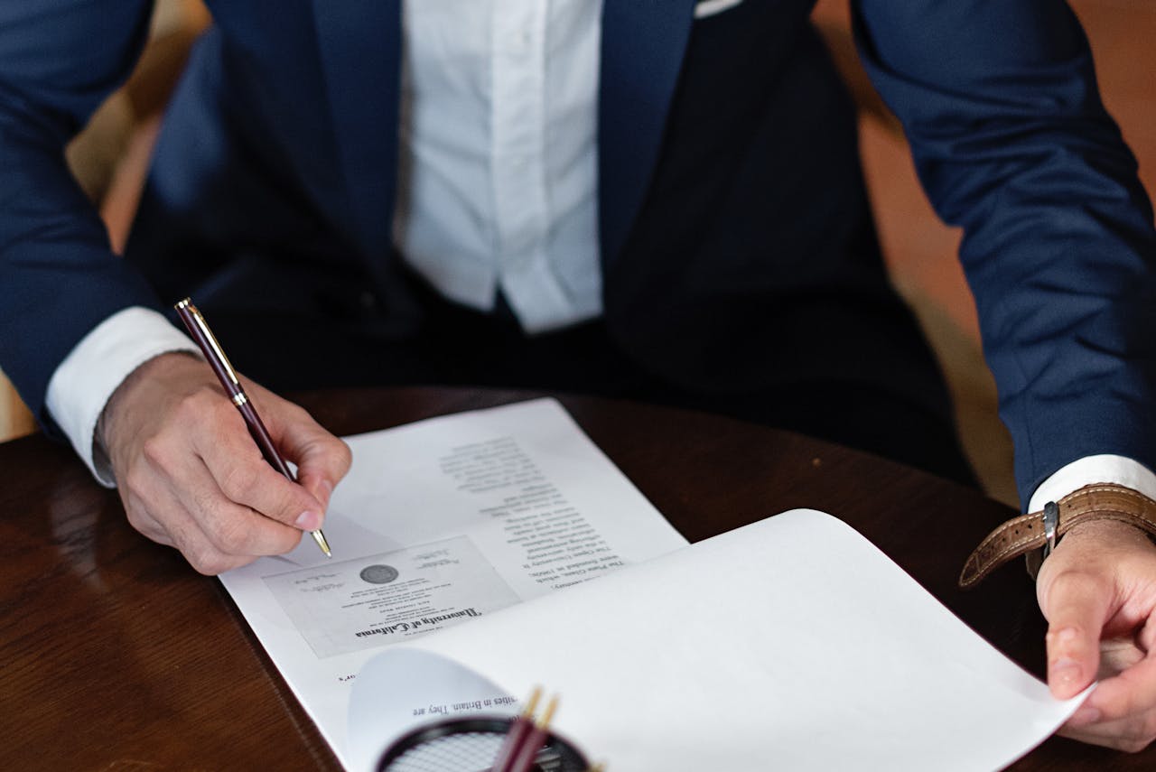 person-signing-documents